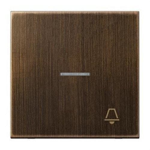 JUNG - Tecla con visor y símbolo timbre latón antik